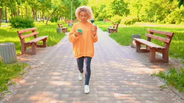 African American Happy Girl Talking with Friend By Phone alt