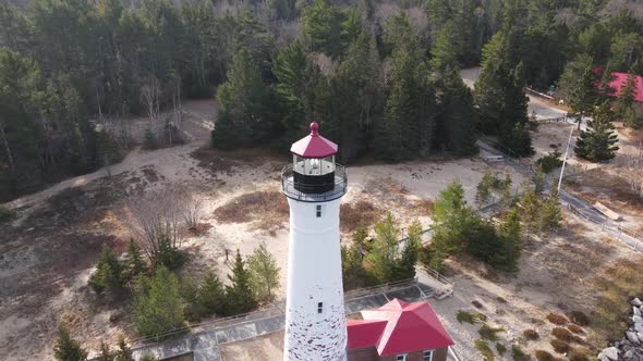4k drone video of Crisp Point Lighthouse in Michigan during the fall. alt