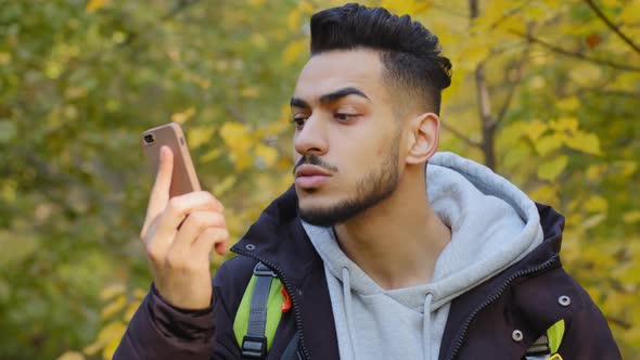 Young Man Standing Outdoors Lagged Behind Tourist Group Lost in Wood Traveling with Backpack alt