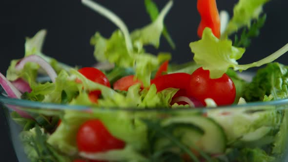 Fresh Salad Flying to Bowl in Super Slow Motion alt