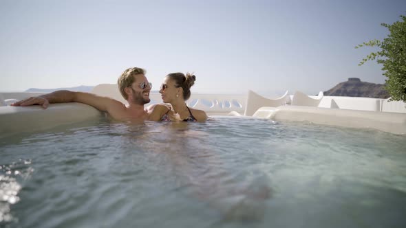 Couple Enjoying Whirlpool on Private Terrace in Santorini