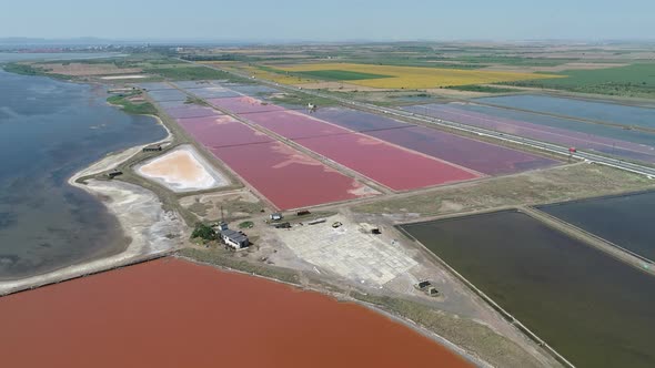 Amazing drone aerial landscape of the beautiful salt ponds, near the beach alt