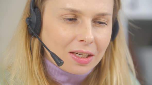 Friendly online support operator speaking with client with cheerful smile in 4k video alt