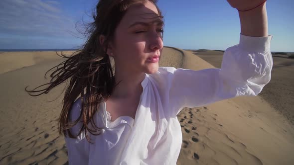 Closeup Portrait of a Beautiful Caucasian Young Woman in the Desert, Wide Angle. Inspiration in