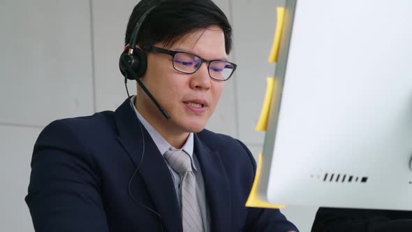 Business People Wearing Headset Working in Office alt