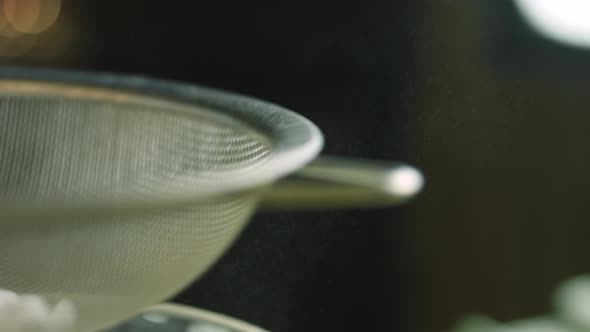 I Give Powdered Sugar Through a Stainless Steel Sieve alt