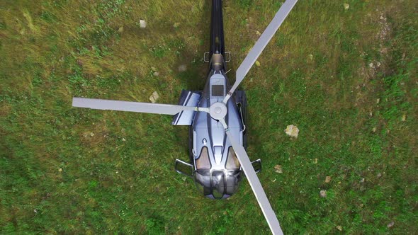 Top View of the Helicopter in the Highlands Landscape. Aerial View alt