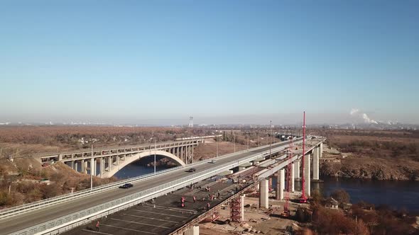 Construction of a new bridge old bridge in the foreground Zaporozhye Ukraine alt