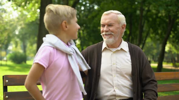 Grandson Runs Up to Grandfather, Embraces Him, Secured Old Age and Family Values alt
