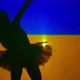 Ballerina Silhouette Dancing at Background of Ukrainian Flag - VideoHive Item for Sale