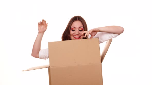 Woman Jumping Out from Cardboard  alt