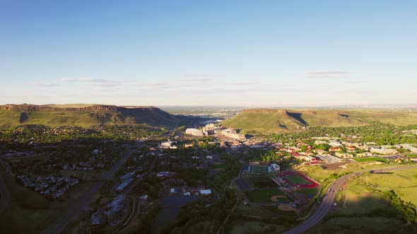 Drone Establishing Shot Of Small Denver City Limits Suburban Town Golden Colorado During Warm Golden alt