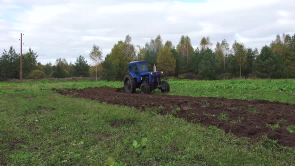 Old Soviet Tractor And Plowing 3