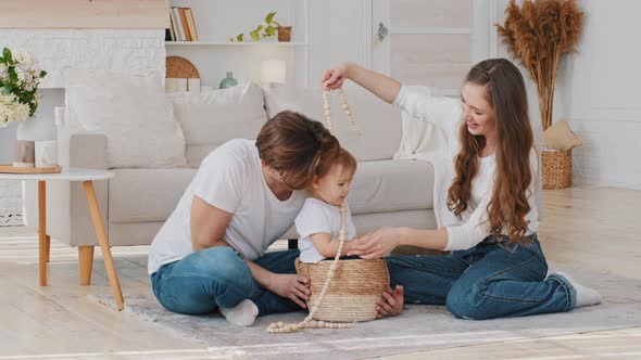 Caucasian Happy Family Young Parents with Little Daughter Having Fun Playing at Home Spend Time alt