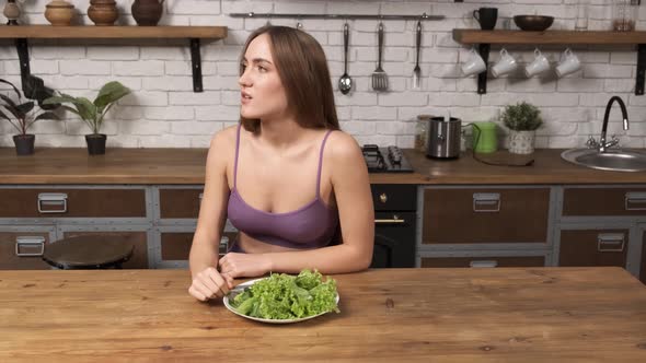 A Personal Trainer Yells Into a Megaphone Making the Girl Eat Salad alt