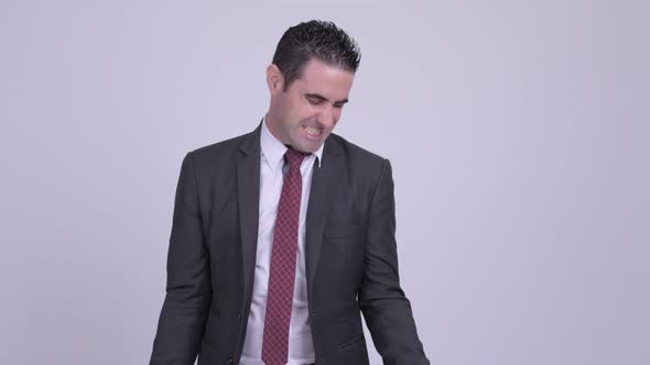 Handsome Businessman Exercising with Dumbbells alt