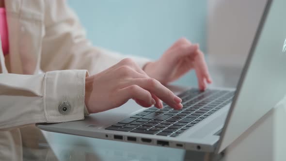 Female Hands Typing on Notebook Keyboard Studying Technology Online