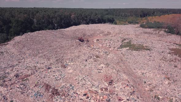 Takeoff Over the Garbage Dump Located in the Forest, Ukraine, Environmental Problem