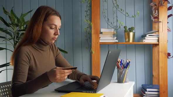 Woman Sit at Desk Using Credit Card and Laptop Make Online Epayment alt