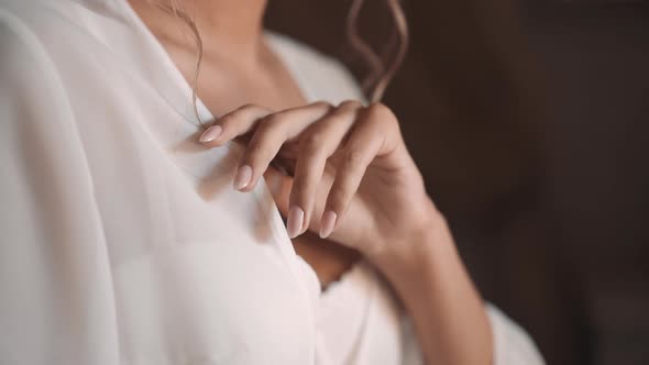 Graceful Woman in Chiffon Peignoir and Bra in Bedroom alt