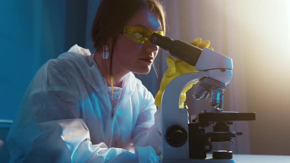 Doctor Video Footage - A Woman Looking Through The Microscope B