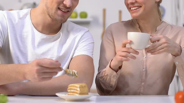Boyfriend Feeding His Girlfriend With Cake alt