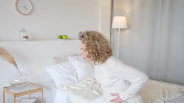 Pregnant Woman Suffering Belly Ache At Home alt