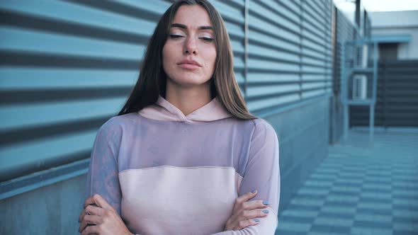 An Attractive Woman Poses for the Cameras Female Straightens Her Hair Winks and Flirts at City alt