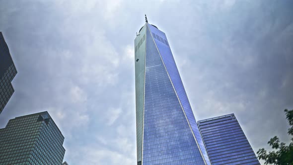 One World Trade Centre Reflecting Cloudy Sky In New York City alt