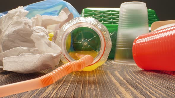 Concept of Pollution of the Planet and Environmental Disaster. A Look Inside the Used Plastic Bottle alt