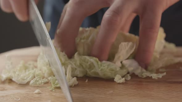Man Cut with Knife and Hand Chinese Cabbage Preparation of Salad Ingredients alt