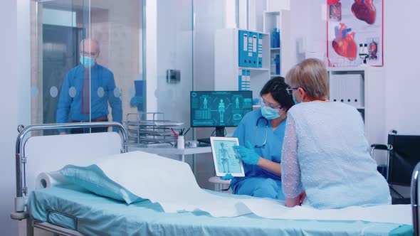 Bones Disease Explanation To Old Retired Woman Patient alt