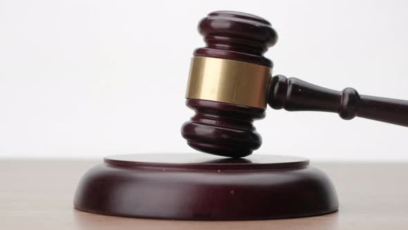 avel being struck to decide an auction or guilty verdict in court, Justice and law concept. alt