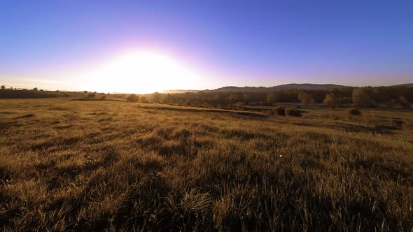  UHD Mountain Meadow Timelapse at the Summer. Clouds, Trees, Green Grass and Sun Rays Movement alt