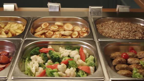 Close Up Shot of the Buffet with a Variety of Food, Containers Rhe Products alt