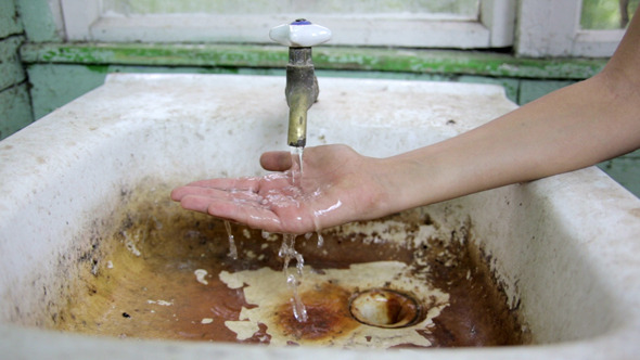 Sink and a Child's Hand