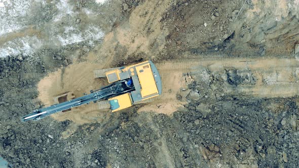 Construction Excavator Works at a Quarry, Moving Sand. alt