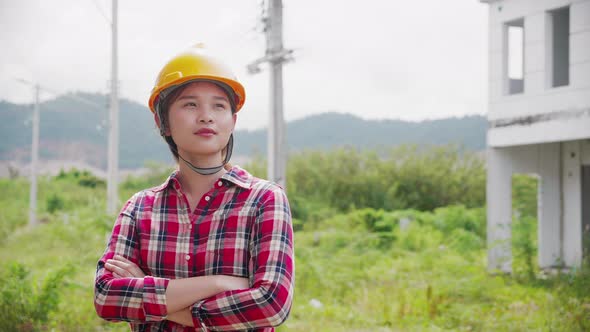 Portrait of Professional woman Engineer / Worker Wearing Safety Uniform, close up.