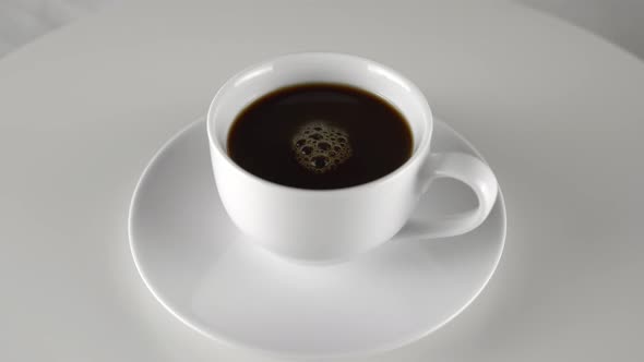 White Coffe Cup on Rotation Table White Background