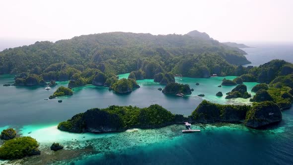 Piaynemo islands in Raja Ampat area Indonesia, Aerial dolly out reveal shot alt