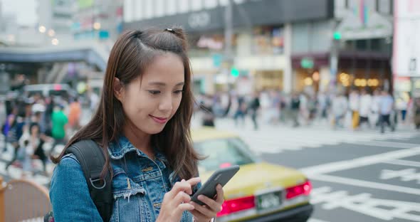 Woman use go travel in Japan and use of mobile phone for check location alt