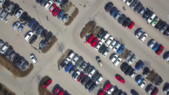Top aerial view of many cars on a parking lot or sale car dealer market. alt