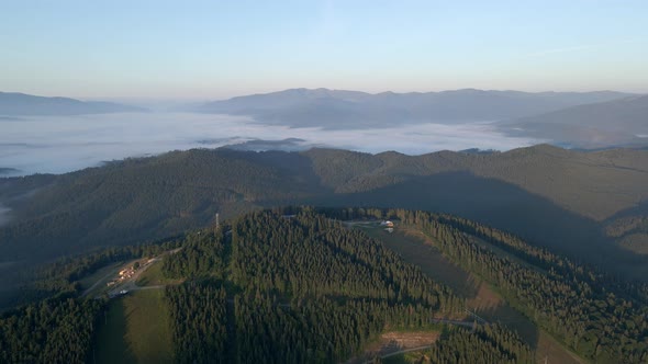 Aerial View of Sunrise Above Bukovel Ski Resort at Summertime alt