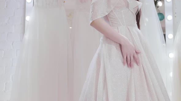 Bride in Cloak Room in Wedding Salon alt
