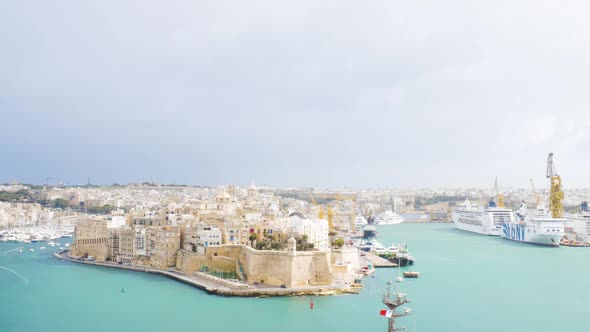 Beauty of Maltese city with moored luxury cruise ships, static view alt