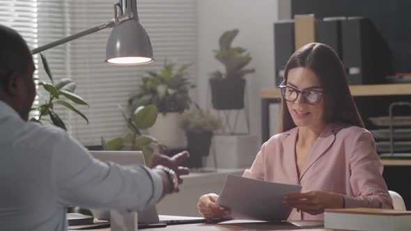 Female HR Manager Interviewing Afro-American Job Applicant alt