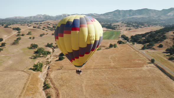 Colorful Hot Air Balloon Epic Flying on Sunny Summer Day Mountains on Background alt