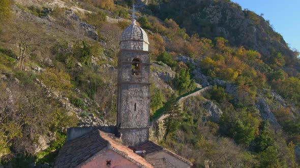 Aerial Shot of the Christian Church on a Way to the Top of the Mountain Where St alt