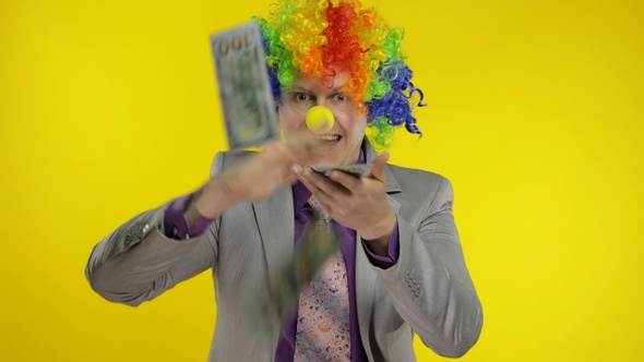 Clown Businessman Entrepreneur Boss in Wig Throws Money Banknotes Dollar Cash alt