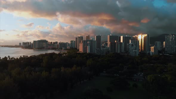 Aerial drone footage of Honolulu, Hawaii. Beautiful real estate, buildings in the city. Palm trees alt